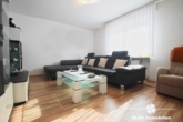 Wohnzimmer - BERK Immobilien – Vermietete 3-Zimmer-Wohnung mit Stellplatz und Gartenanteil in Stockstadt