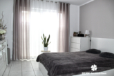 BERK Immobilien - Schlafzimmer - BERK Immobilien – Vermietete 4-Zimmer-Wohnung auf zwei Etagen in Sulzbach mit Garten und Terrasse