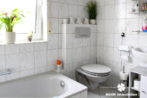 BERK Immobilien - Bad EG - BERK Immobilien – Vermietete 4-Zimmer-Wohnung auf zwei Etagen in Sulzbach mit Garten und Terrasse