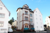 Titelbild - BERK Immobilien – Attraktive Renditeimmobilie: Voll vermietetes Wohn- und Geschäftshaus in zentraler Stadtlage