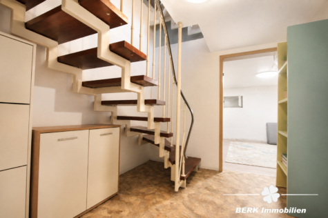 BERK Immobilien – Gepflegtes Reihenmittelhaus mit Garten, Balkon und Garage - KG Flur (124558)
