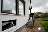 EG- Gartenabgang - BERK Immobilien – Top gepflegtes ZFH mit gemütlichem Garten in schöner Lage von Laufach