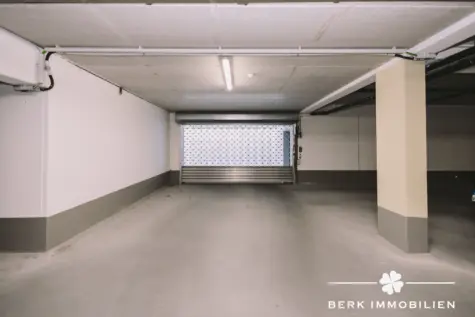 BERK Immobilien – 4-Zimmer-Neubau-Erdgeschosswohnung mit sonniger Terrasse in 1a Lage von Alzenau - Tiefgarageneinfahrt (130463)