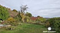 Garten - BERK Immobilien – Charmantes Einfamilienhaus direkt am Weinberg in sonniger Lage von Großheubach