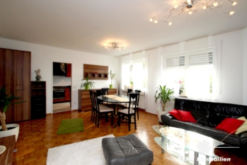 BERK Immobilien – Gepflegte 2-Zimmer-ETW mit großzügiger Terrasse, Garten und Garage in Stockstadt - Wohnbereich (107127)