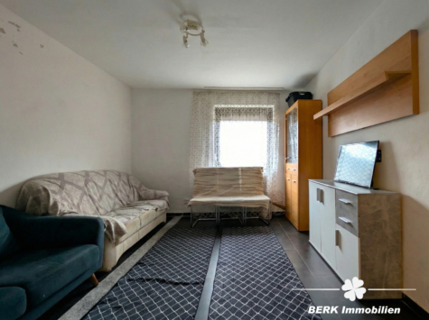 BERK Immobilien – Zweifamilienhaus mit attraktiver Rendite & Entwicklungspotenzial in Heigenbrücken - Wohnzimmer UG (116117)