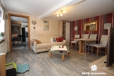 Wohnzimmer - BERK Immobilien – Kompakt, charmant, einladend – Einfamilienhaus zum Wohlfühlen