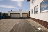 Außenansicht - (KI optimiert) - BERK Immobilien – Gepflegtes 3-Familienhaus mit großem Grundstück und vielseitigen Möglichkeiten