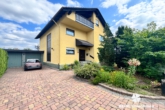 Hausansicht - BERK Immobilien – Charmantes Einfamilienhaus mit schönem Garten in TOP-Wohnlage von Mainaschaff