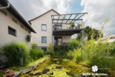 Rückansicht - *VERKAUFT* BERK Immobilien – kleine Oase mit viel Platz: top gepflegtes ZFH in Mainaschaff