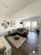Wohnzimmer - BERK Immobilien – Singlewohnung mit Balkon in ruhiger Innenstadtlage
