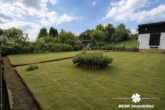 Garten (KI-optimiert) - BERK Immobilien – Wohnen und Ausbauen auf einem großzügigen Grundstück mit ca. 1.283 m²