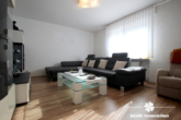 Wohnbereich - BERK Immobilien – Vermietete 3-Zimmer-Wohnung mit Stellplatz und Gartenanteil in zentraler Ortslage