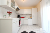 Küche - BERK Immobilien – Vermietete 3-Zimmer-Wohnung mit Stellplatz und Gartenanteil in zentraler Ortslage